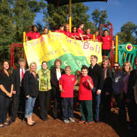<p>School officials, PTA members, peer leaders and Senator Ball give the playground a warm welcome.</p>