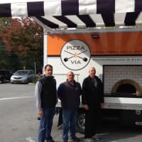<p>Joe Bueti, left, Anthony Luppino and John Cioffe hope the PizzaVia truck makes stops all throughout the county.</p>