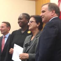 <p>A new citizen poses with County Executive Rob Astorino, Justice Janet Malone and County Clerk Timothy Idoni.</p>