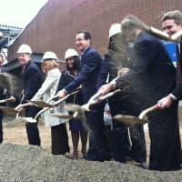 <p>Gov. Dannel P. Malloy, center, tosses some gravel with other dignitaries in front of J. M. Wright Technical High School Thursday. A ceremonial groundbreaking was held at the Stamford school that will reopen next year.</p>