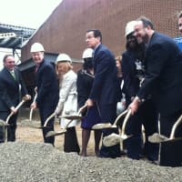 <p>Gov. Dannel P. Malloy, center, gets ready to toss some gravel with other dignitaries in front of J. M. Wright Technical High School Thursday. A ceremonial groundbreaking was held at the Stamford school that will reopen next year.</p>