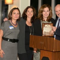 <p>Rob Greenstein presents Consulting for a Cause with the New Business of the Year award.</p>
