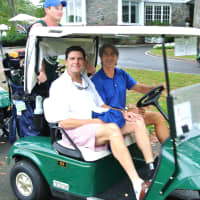 <p>Golfers like Bernie Curry (left) were able to make the Christopher D. Mello Golf fundraiser a success despite rainy conditions</p>