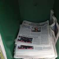 <p>Copies of the Hudson Valley Reporter in an Examiner display box in Carmel.</p>