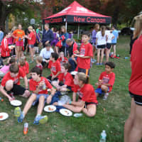 <p>Runners from the New Canaan Running Club relax after Wednesday&#x27;s race.</p>