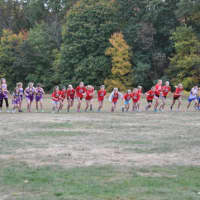 <p>New Canaan girls, in red, run against Wilton and New Fairfield.</p>