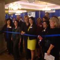 <p>Organizers and sponsors of Recruit Westchester cut the ribbon on the event to let in students and alumni.</p>