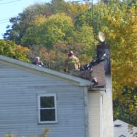 <p>Investigators search for possible victims in Elmsford following a fire Saturday night.</p>