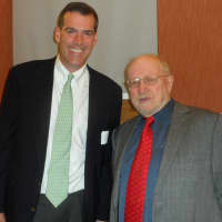 <p>Bruce Ferguson and John Berry chat at the Darien Library annual meeting.</p>