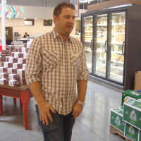 <p>Michael Sinatra, the public relations manager for Whole Foods, leads a tour of the new location in Port Chester.</p>
