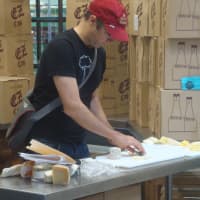 <p>A Whole Foods Port Chester employee prepares cheeses for the opening celebration Tuesday.</p>
