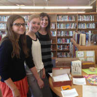 <p>Seventh graders Isabela Fox-Mills, left, and Stella Ard are big fans over Wendy Mass, right, and her book &quot;Jeremy Fink and the Meaning of Life.&quot;</p>