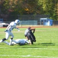 <p>Rye Neck&#x27;s Pedro Cueto (in black) dives for a first down.</p>