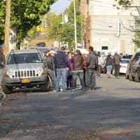 <p>Neighbors gathered on South Bond Street in Mount Vernon to discuss the fire.</p>