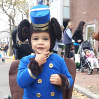<p>Pierce Francia, 2, enjoys trick-or-treating in downtown Westport Tuesday.</p>