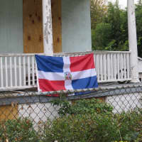 <p>Their national flag hangs from the railing outside the Mount Vernon home.</p>