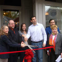 <p>Ossining officials and owners Steven and Jessica Vescio celebrate the grand opening of Keenan House.</p>