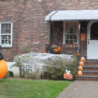 <p>Jubilant pumpkins line a White Plains home&#x27;s entranceway.</p>