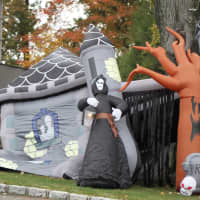 <p>A blow-up haunted forest decorates the lawn of this Scarsdale home.</p>