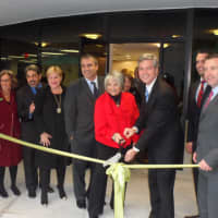<p>White Plains Mayor Tom Roach and the management team of Better Homes and Gardens Rand Realty cuts the ribbon at its new office in White Plains.</p>