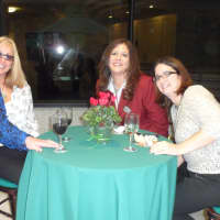 <p>Better Homes and Gardens Rand Realty staff members celebrate at their White Plains office.</p>