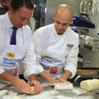 <p>Astorino and Chef Holzwarth roll dough to be cut into gnocchi.</p>