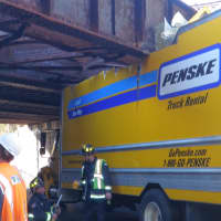 <p>A Penske moving truck became stuck underneath the Saugatuck Avenue railroad bridge in Westport on Wednesday morning.</p>
