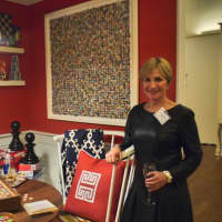<p>Darien resident and designer for Stamford&#x27;s Last Detail Interior Design Carey Karlan stands with her room &quot;Game On&quot;. </p>