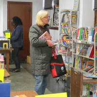 <p>One customer looks through the children&#x27;s section in Mount Vernon.</p>