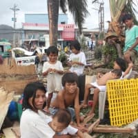 <p>Rafael, 10, with his family, is a Typhoon Haiyan survivor from the Philippines. </p>
