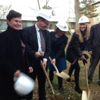 <p>Groner, second from the right, was joined by Superintendent Jere Hochman, right, and school board President Susan Wollin, left, and others for the groundbreaking Thursday.</p>