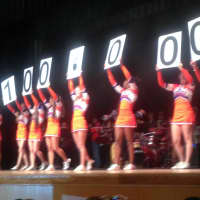 <p>The Danbury High School cheerleaders spell out the size of the prize at Thursday&#x27;s assembly. </p>