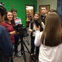 <p>A green screen in the studio has allowed the students to make good use of different background images for specific segments.</p>