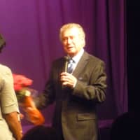 <p>Regis Philbin gives flowers and serenades a lucky girl.</p>