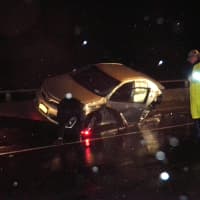 <p>One of the cars involved in Wednesday morning&#x27;s crash came to rest on top of the guardrail in the breakdown lane.</p>