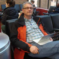 <p>Dan Wallace gets ready to travel at the Westchester County Airport.</p>