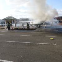 <p>Norwalk firefighters knock down the fire on board the boat on Friday afternoon at the boat launch. </p>