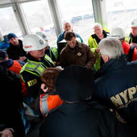 <p>Members of the NTSB team meets with New York local and state officials at the train derailment scene.</p>