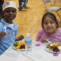 <p>Children enjoy a Thanksgiving feast at the Boys &amp; Girls Club of Stamford.</p>