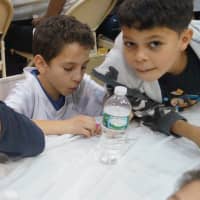 <p>Children enjoy a Thanksgiving feast at the Boys &amp; Girls Club of Stamford.</p>