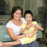 <p>Amy Marchesi holds a child at the Vietnam orphanage.</p>