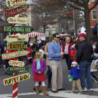 <p>Signs point the way at the Rye Chamber of Commerce Mistletoe Magic festival.</p>