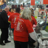 <p>Long lines at the register of the White Plains K-Mart as dozens of volunteers purchased clothes, blankets and other necessities for needy families.</p>
