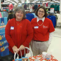 <p>Mary Ellen Ros and Shannon Kelly cheerfully greet shoppers at the White Plains K-Mart Saturday.</p>