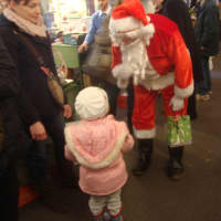 <p>Santa Claus stopped by the Country Living Holiday Bazaar to delight young shoppers.</p>