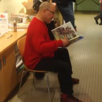<p>Illustrator Jerry Pinkney reads from &quot;Black Cowboy, Wild Horses&quot; at the Katonah Museum of Art.</p>
