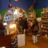 <p>A Nu Toy Store owner Angel Rafter, left, offers customers hometown service.</p>
