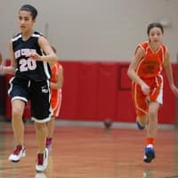 <p>New Canaan&#x27;s Olivia Cosco brings the ball up court.</p>