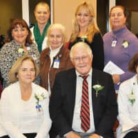 <p>Linda St. Pierre, Joseph Jordan and Dr. Donna Coletti (seated l-r) joined other Home Hospice Program team members at a reception following the Tree of Light ceremony on Monday.
</p>