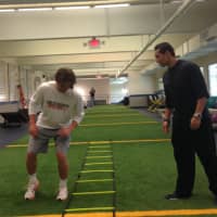 <p>Chris Zapata, BlueStreak&#x27;s Facility Director at Chelsea Piers, works with Kyle Dunster.  </p>